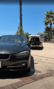 Black BMW 3 Series sedan after a professional mobile car detailing service in Redlands, CA, with ceramic coating protection offered by Luxury Auto Detailing.